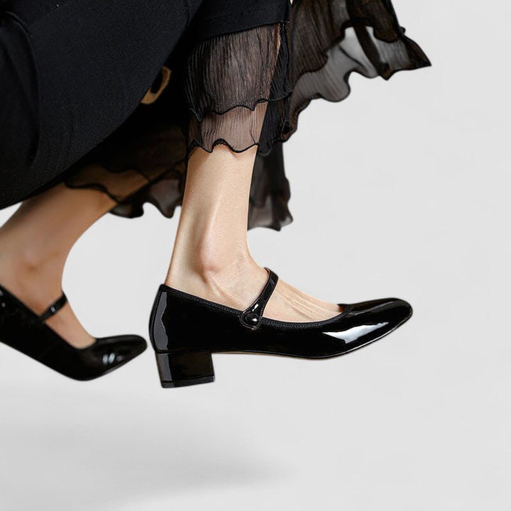 Women's elegant round toe Mary Jane shoes featuring a comfortable strap and block heel.