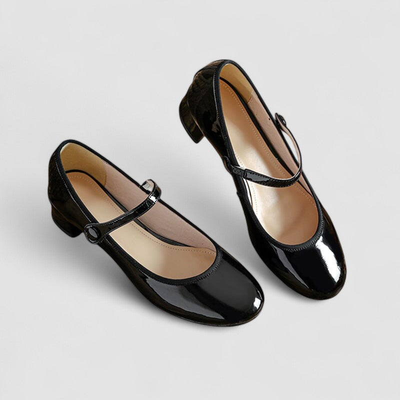Fashionable & comfortable women's patent Mary Jane block heel shoes with a glossy finish.