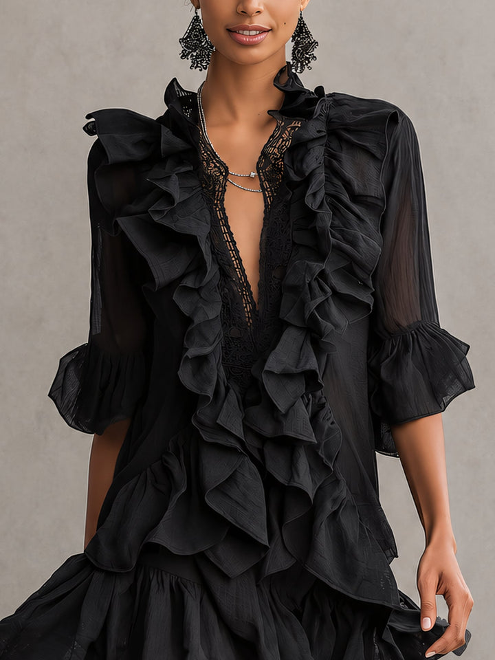Stylish black mini dress for women with elegant sheer long sleeves and a flattering V-neck, ideal for parties.