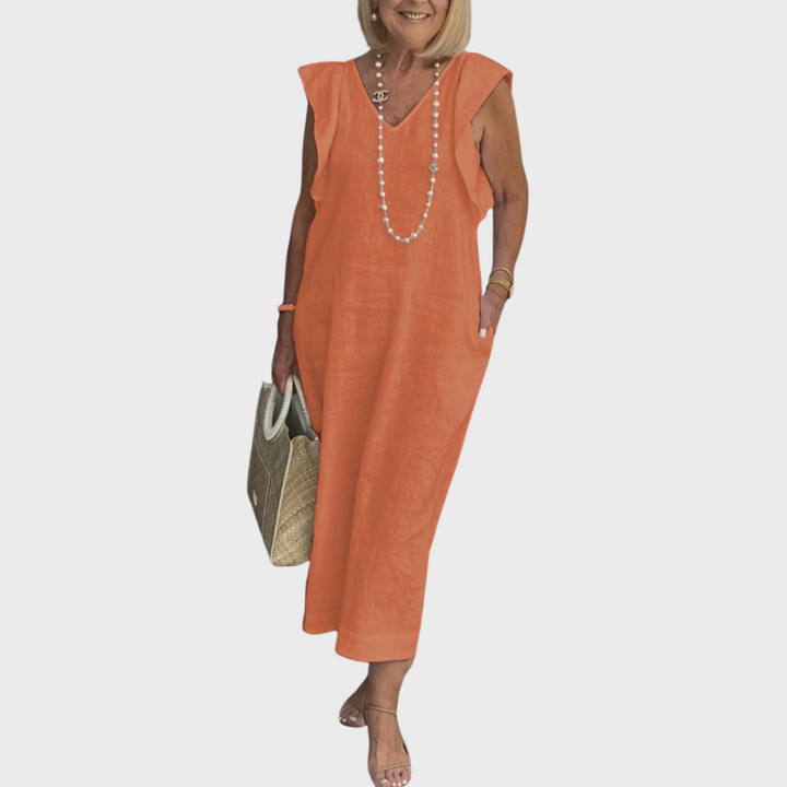 Chic black sleeveless V-neck maxi dress for women, designed with ruffle shoulders and hidden pockets.