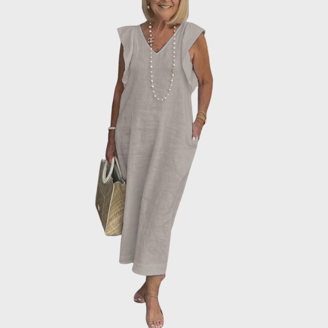 Elegant long women's dress: sleeveless, V-neck, ruffle shoulders, and side pockets, great for casual elegance.
