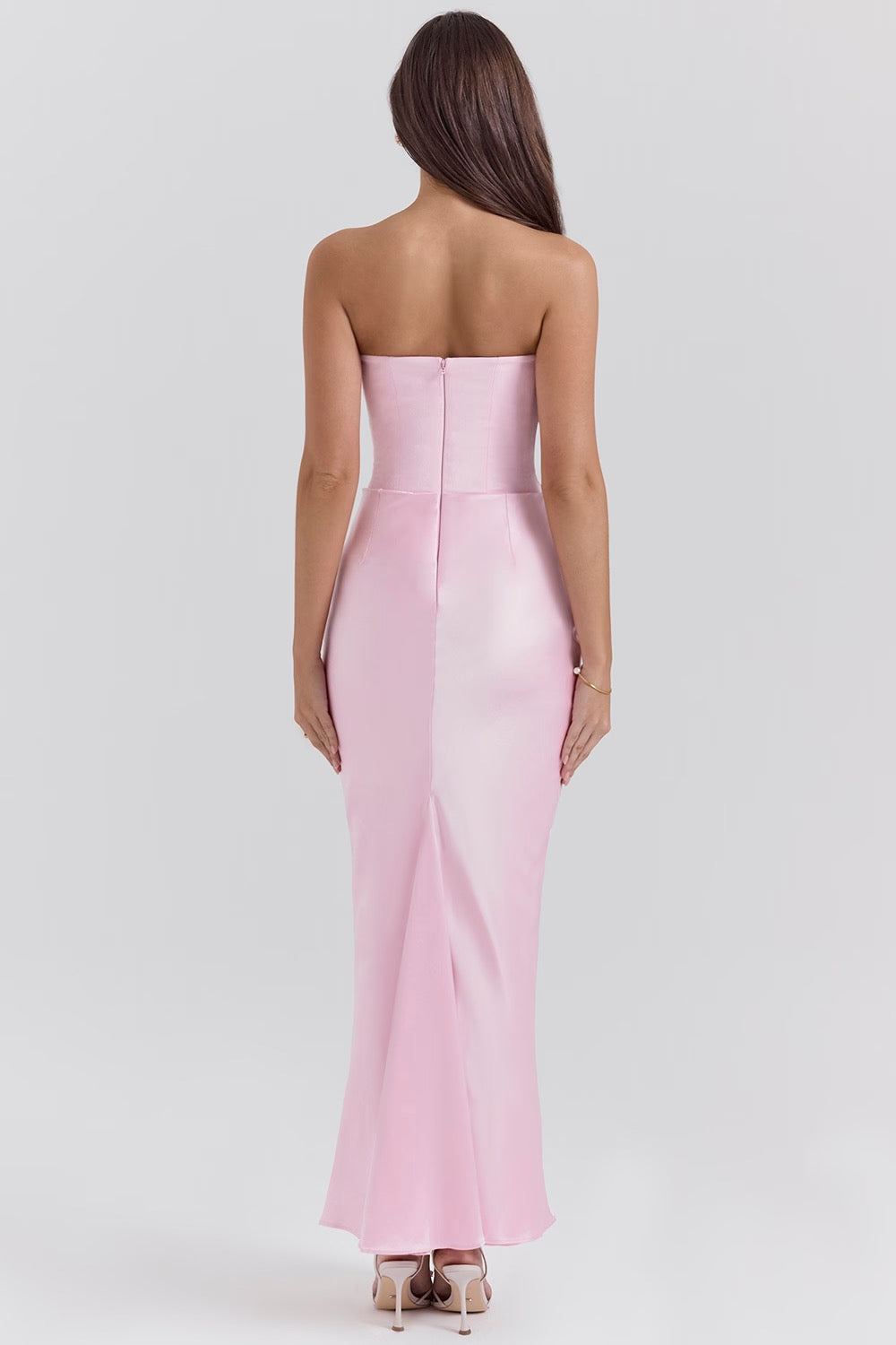 Women's elegant black strapless corset dress, a long maxi style for wedding guests.