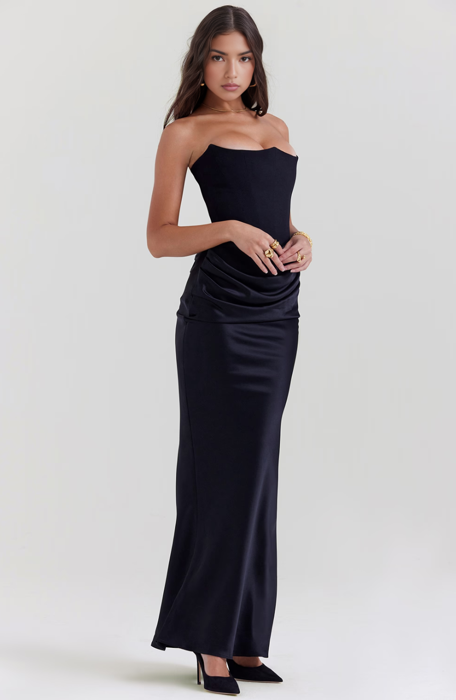 Elegant black strapless maxi dress with a corset, designed for special occasion wear.