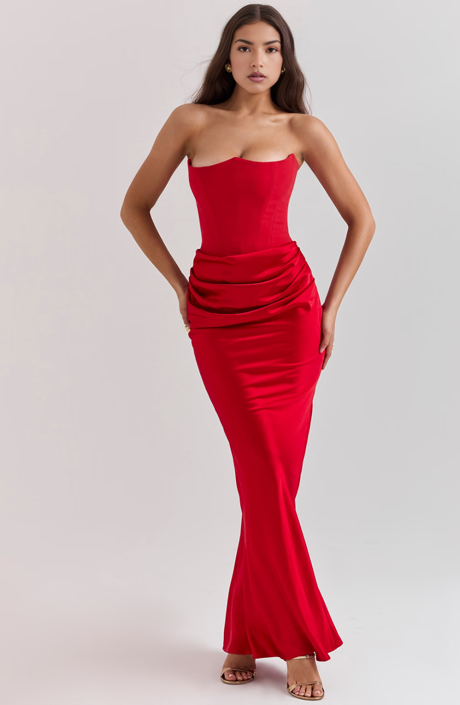 Sleek black strapless evening dress with corset detail. A timeless formal maxi gown.