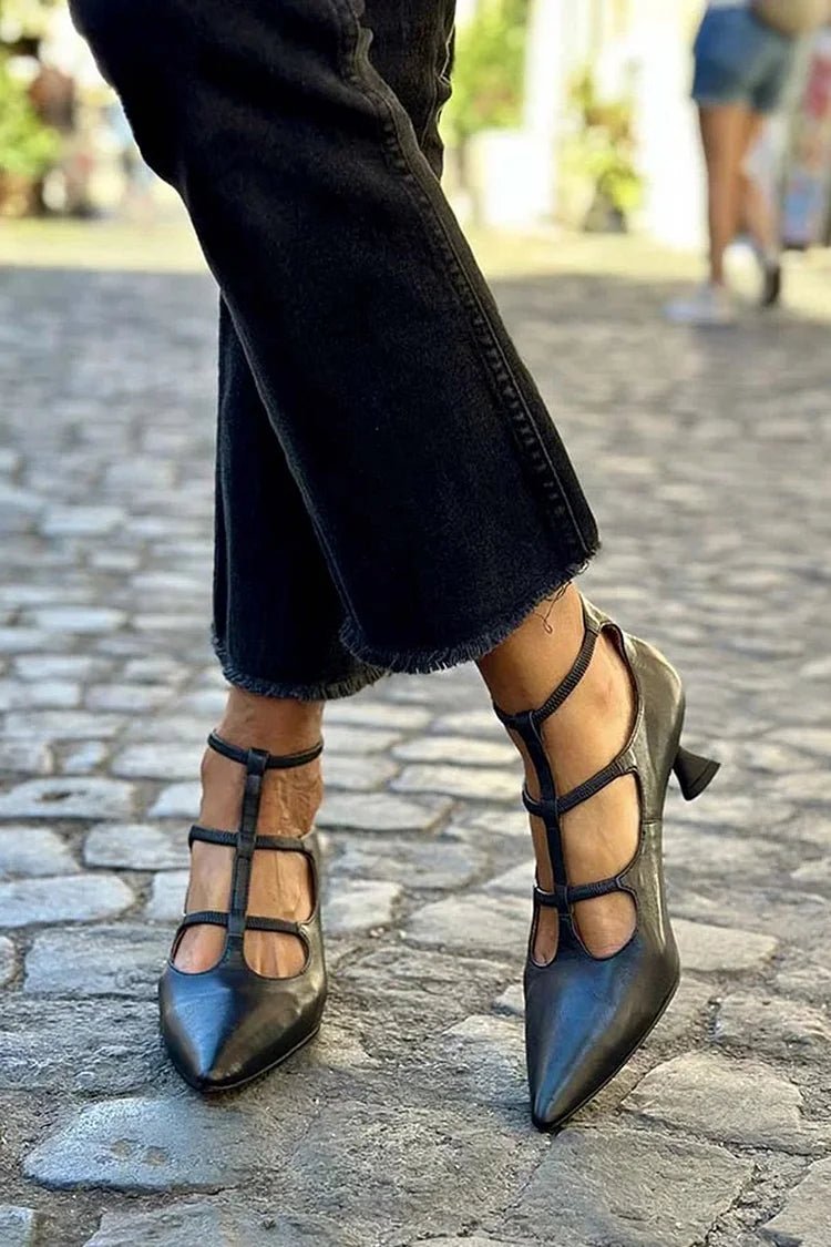 Elegant black strappy kitten heel pumps for women, perfect for wedding guests, evening, or special occasions. Pointed toe.