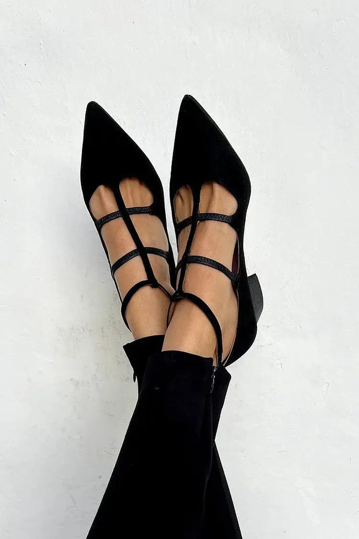 Elegant black strappy pointed toe flats for women, comfortable and versatile for everyday wear or evening events.