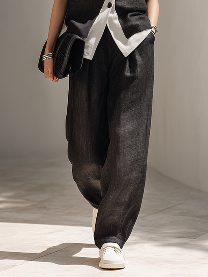 Chic black two-piece women's set with an elegant vest top and comfortable wide-leg pants, ideal for office and evening.