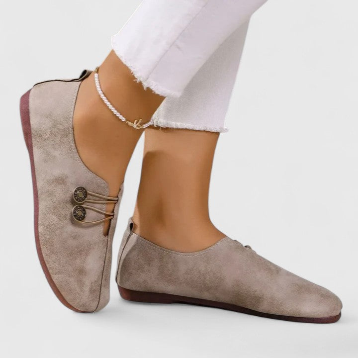 Elegant black women's foldable loafers with elastic button, perfect for travel & comfort.