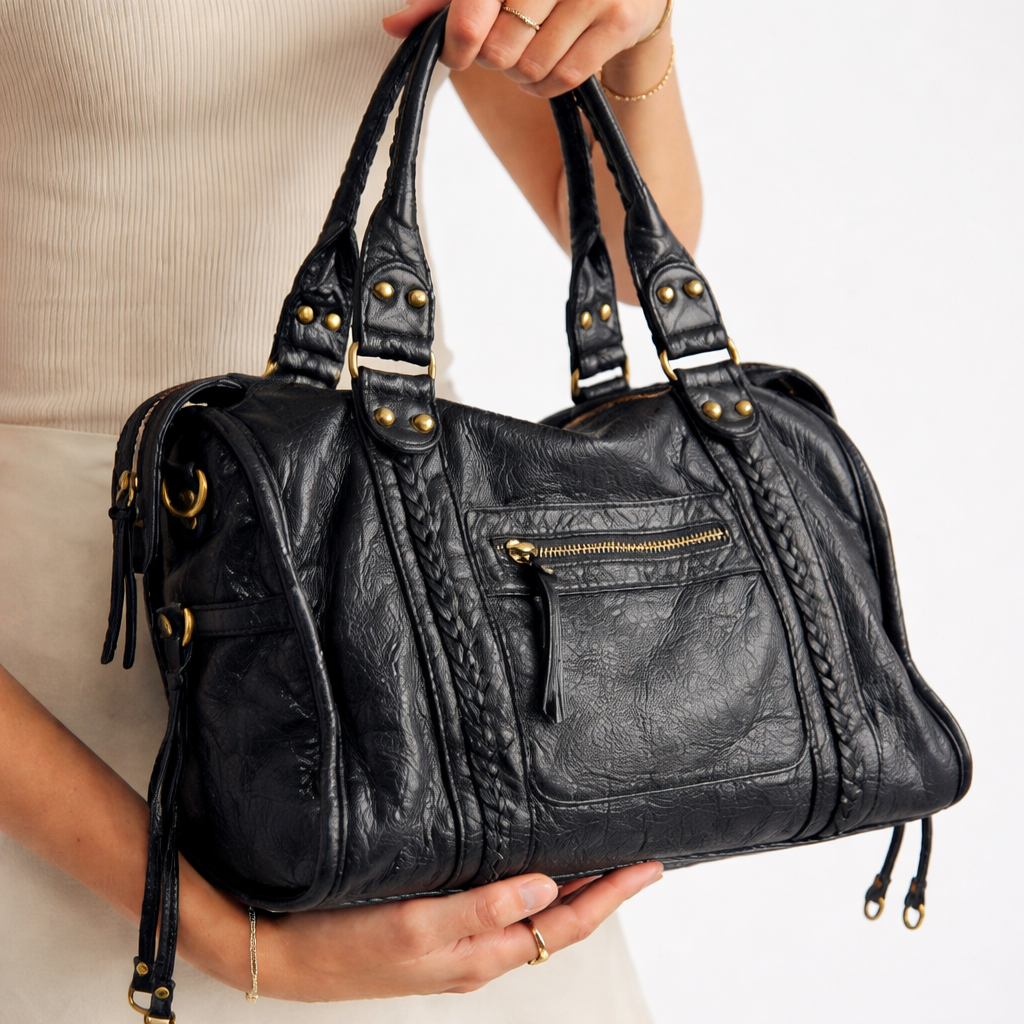 Elegant black women's shoulder bag, versatile for daily carry. Can be worn as a crossbody, stylish & sophisticated.