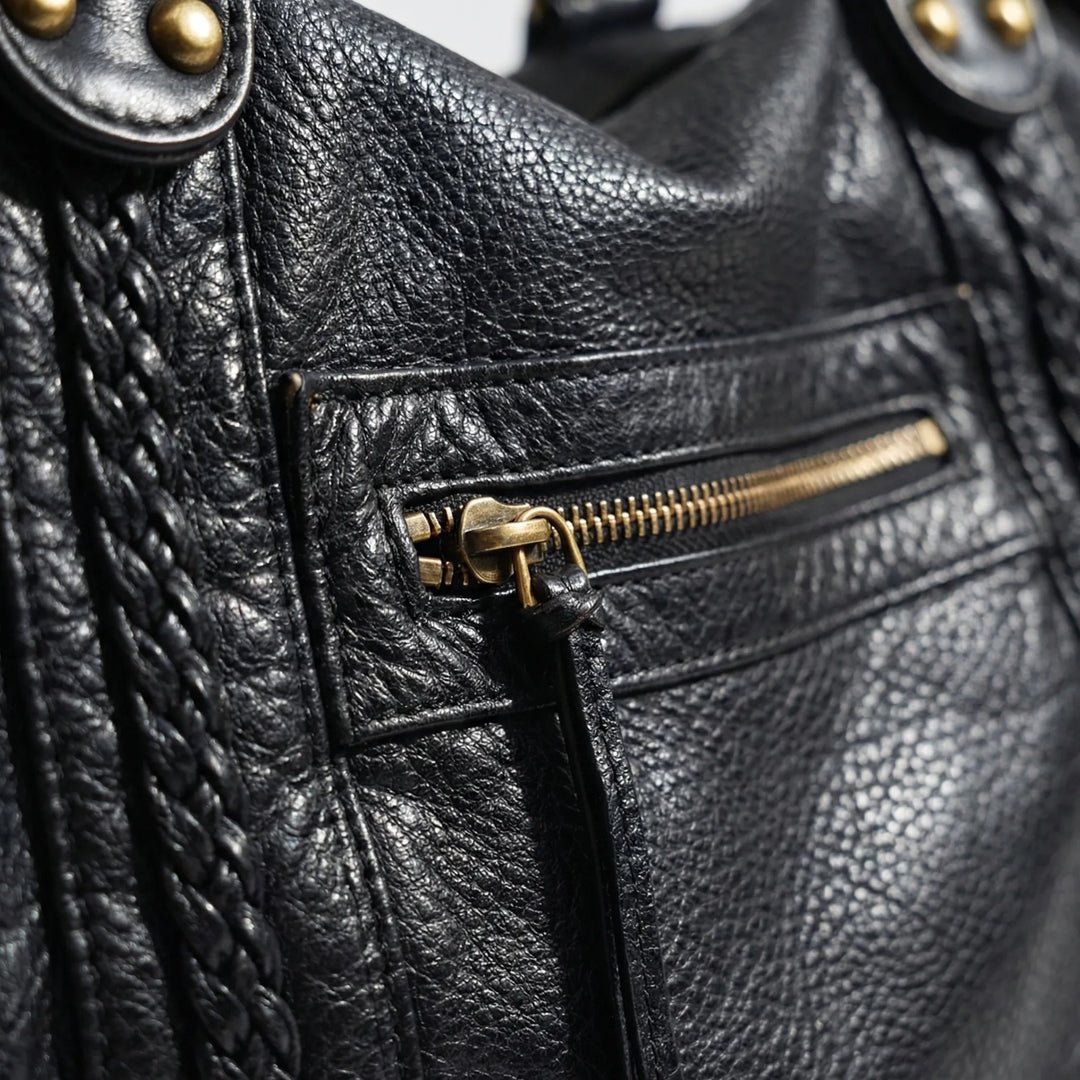 Sophisticated women's black shoulder purse, versatile for any outfit. Stylish fashion bag, also converts to crossbody.