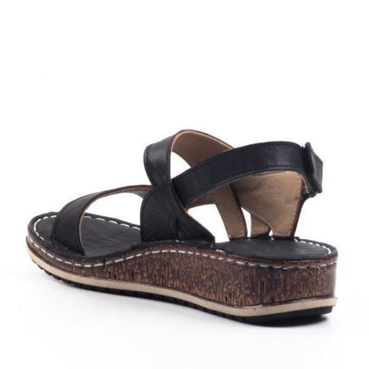 Dressy blue women's platform wedge sandals, combining comfort and elegance for warm weather footwear.