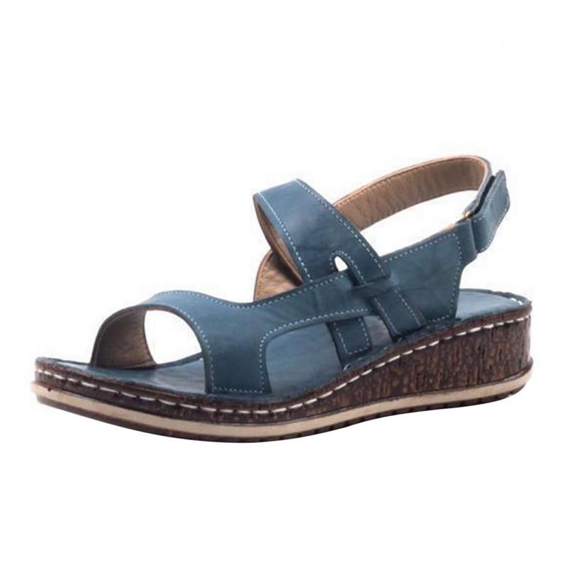 Elegant white women's summer wedge sandals with a comfortable heel for a chic and stylish look.