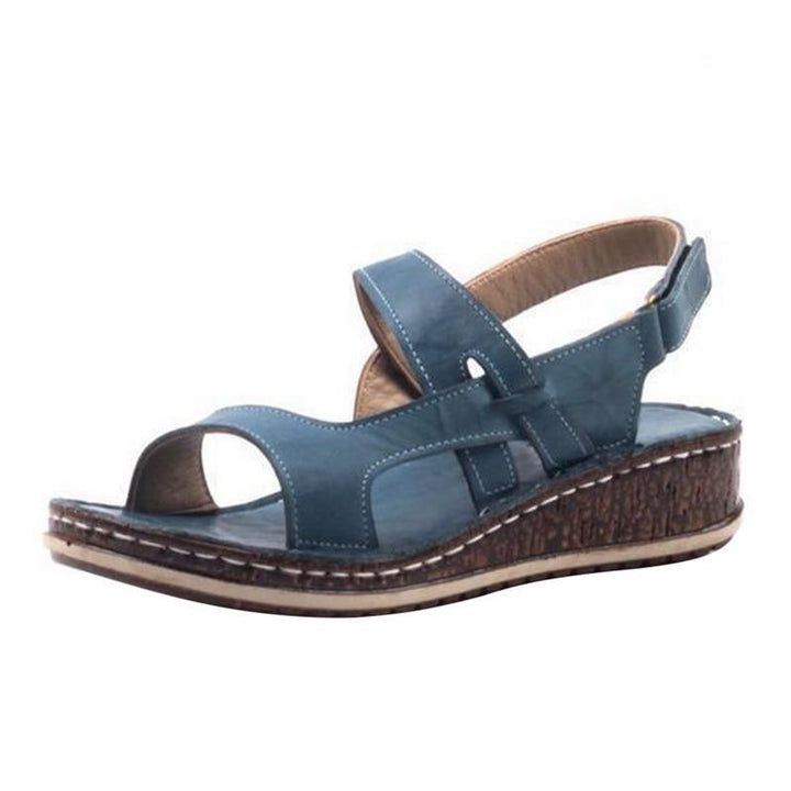 Elegant white women's summer wedge sandals with a comfortable heel for a chic and stylish look.