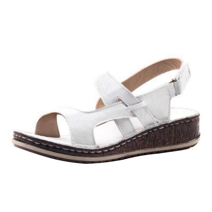 Stylish blue women's wedge sandals, an elegant and comfortable choice for summer footwear fashion.