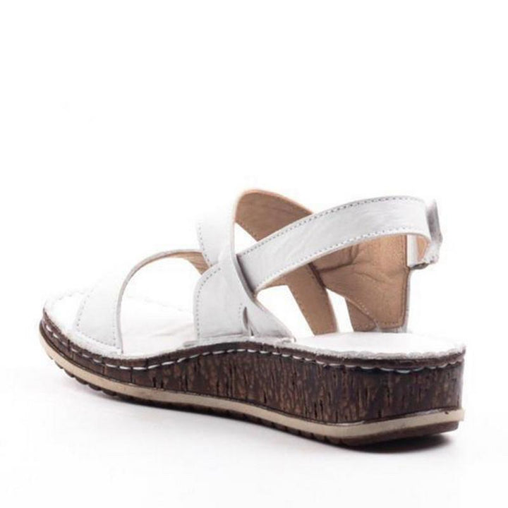 White elegant women's platform wedge sandals, ideal for warm weather comfort and chic summer style.