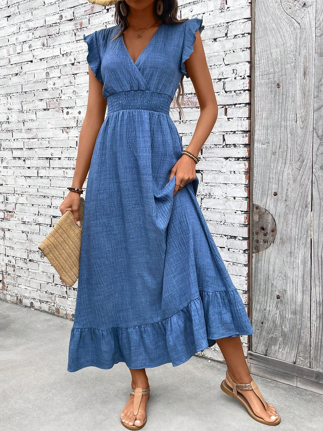Elegant blue V-neck smocked waist ruffle hem maxi dress for women. Perfect for summer, vacation, or casual boho style.