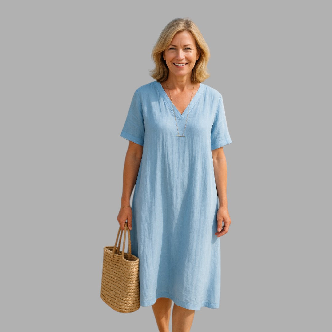 Elegant blue women's midi dress with a flattering fit, perfect for semi-formal occasions and refined style.
