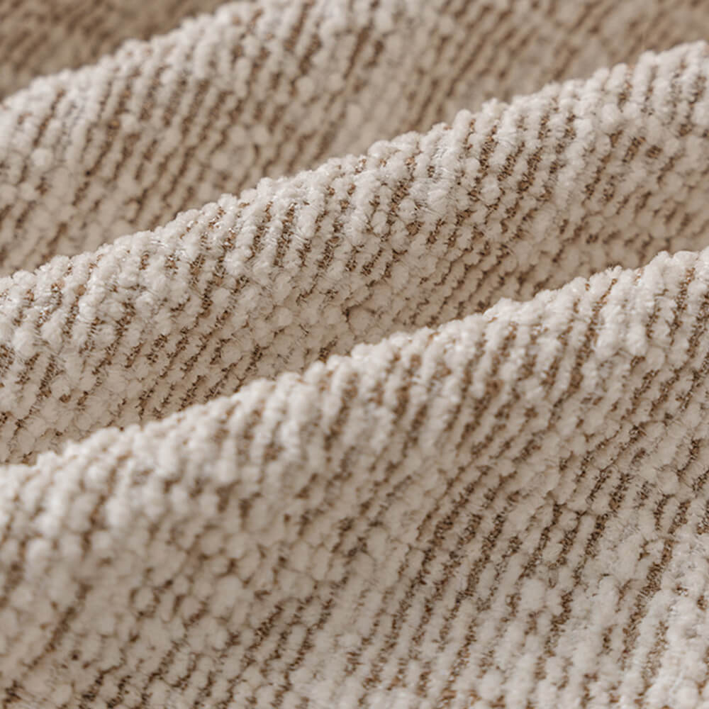 Detail of how the full wrap stretch sofa cover fits snugly, showing elastic band and secure fit