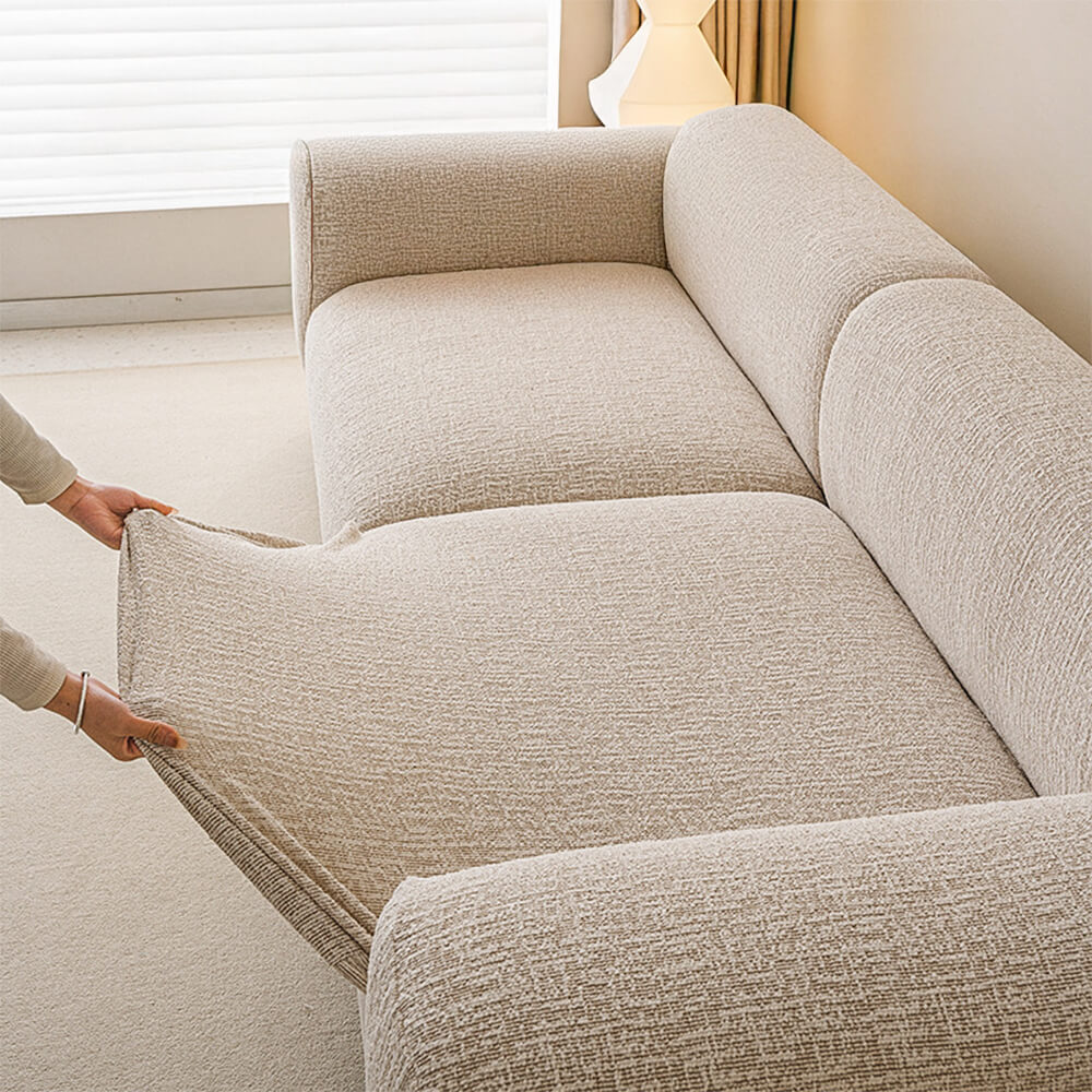 View of the back of a sofa encased in an all-season anti-scratch full wrap chenille couch cover