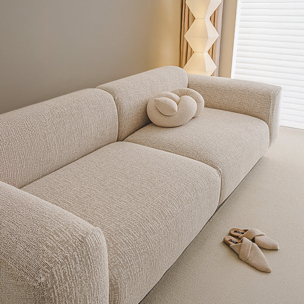 Textured chenille stretch sofa cover illustrating its soft feel and robust anti-scratch properties