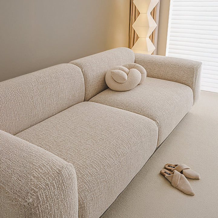 Textured chenille stretch sofa cover illustrating its soft feel and robust anti-scratch properties
