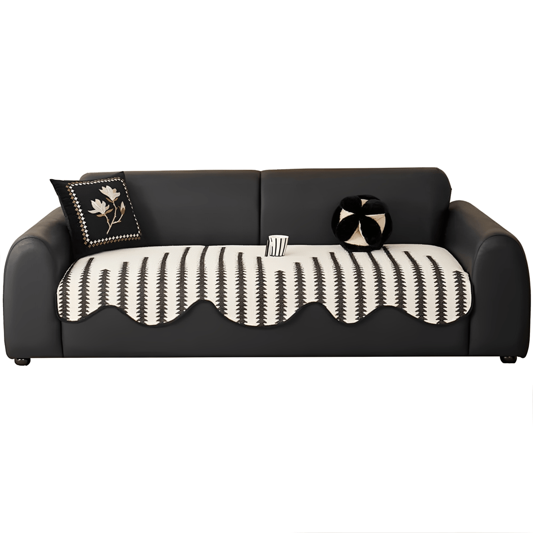 Chevron chenille sofa cover draped over a couch, indicating easy washable maintenance