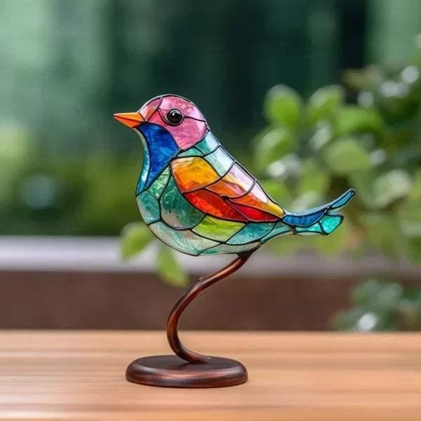 Elegant colored glass bird figurine, a delicate tabletop art piece for modern home decor.
