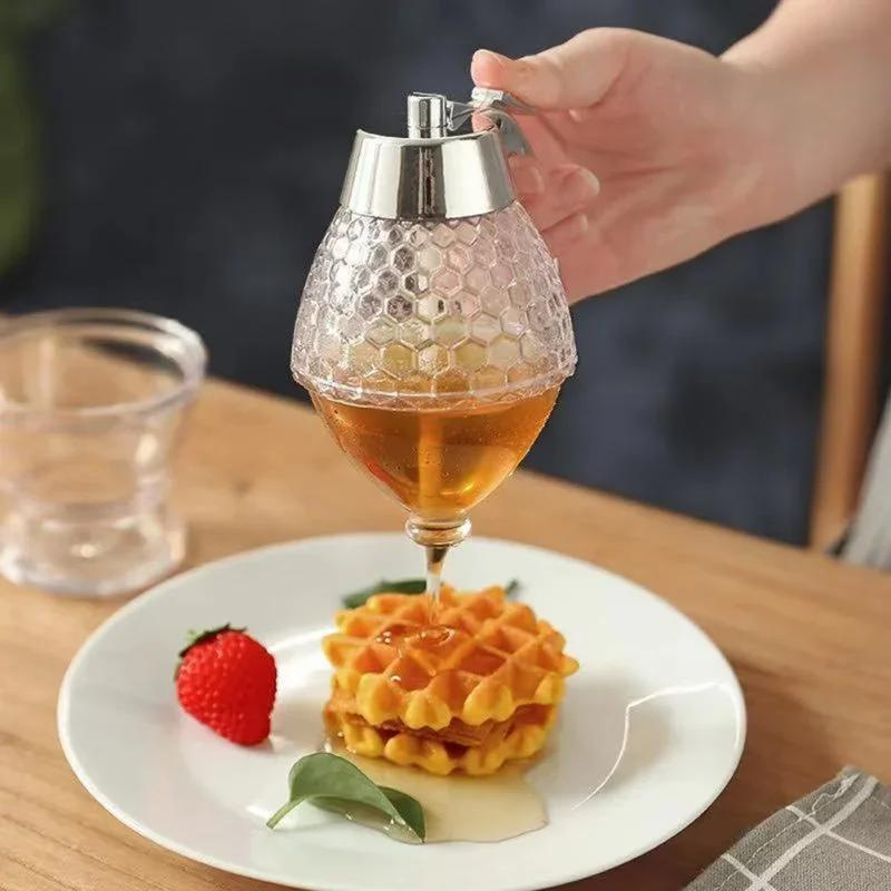 Easy-serve drip-free honey dispenser ensures no sticky messes when pouring syrup, great for home kitchens.