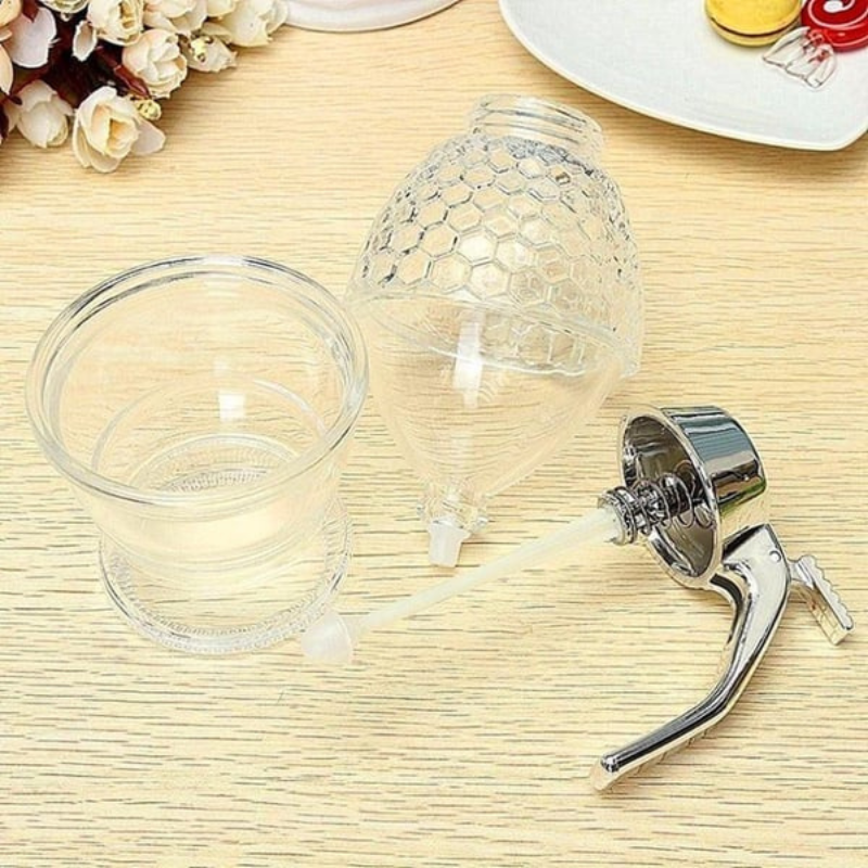 Modern transparent drip-free honey dispenser, an elegant and practical serving solution for any kitchen.