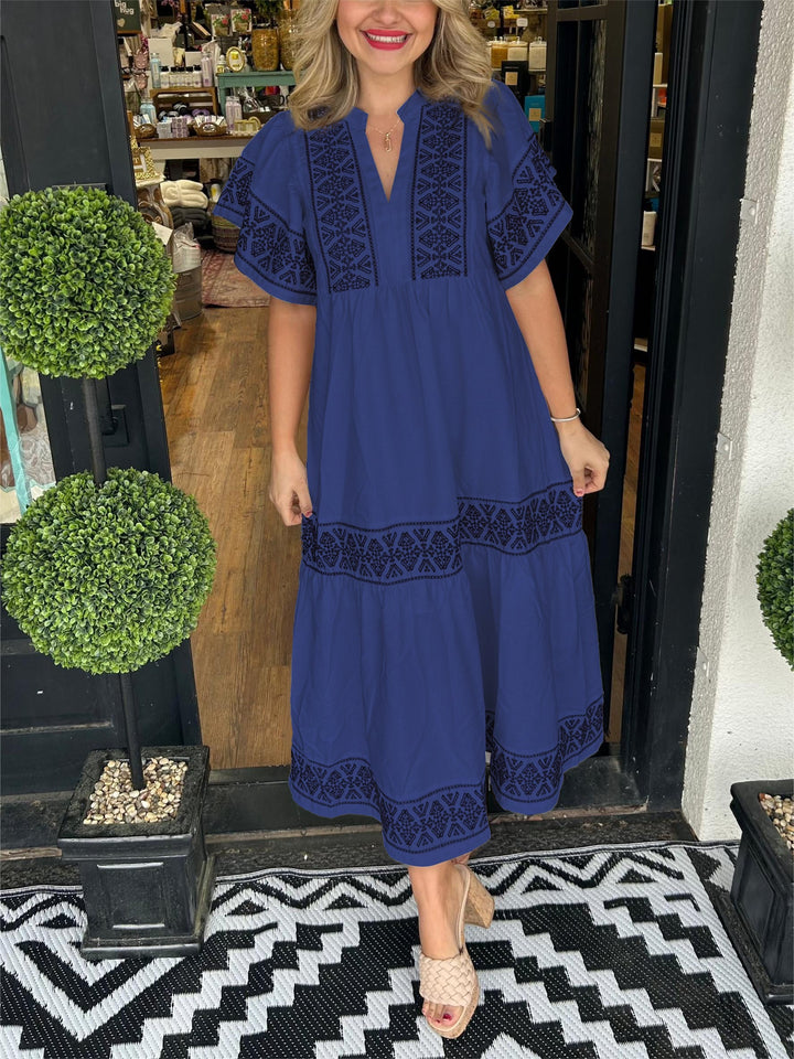 Versatile elegant embroidered boho midi dress, ideal for casual wear or summer events, featuring unique design.