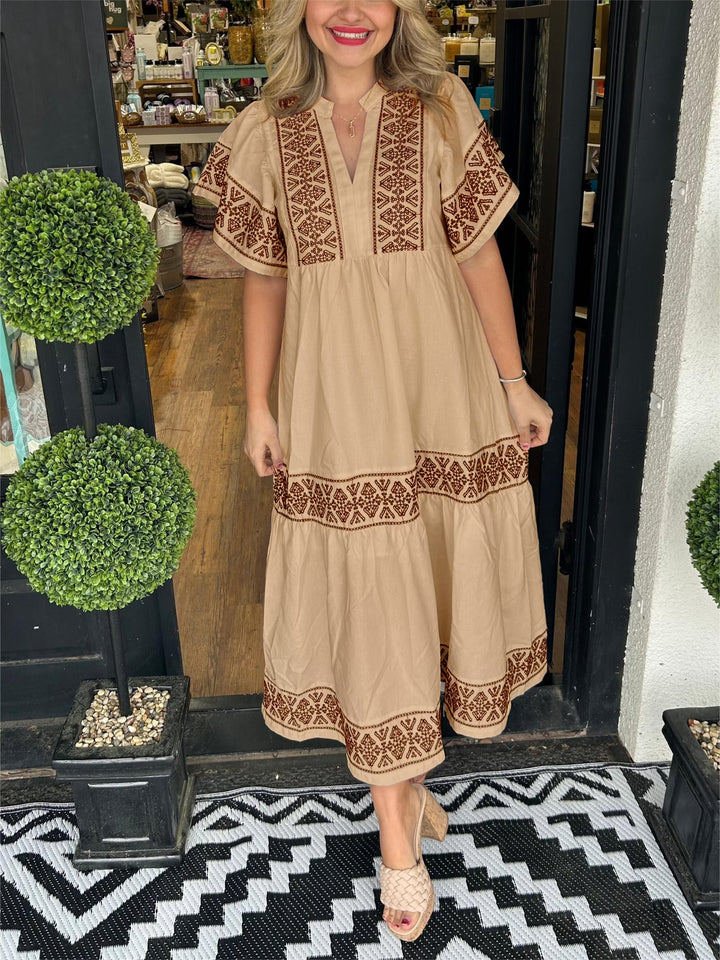 Beautiful women's long sleeve embroidered boho midi dress, combining comfort and chic summer fashion.