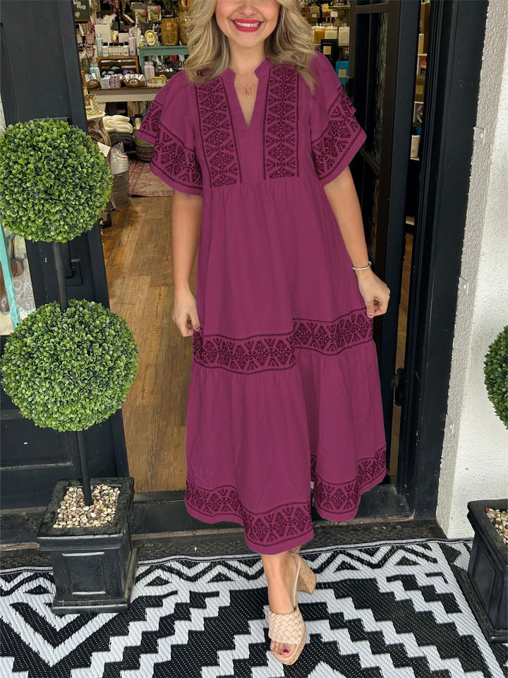 Elegant yet casual embroidered boho midi dress for women, featuring intricate detailing and a chic A-line silhouette.