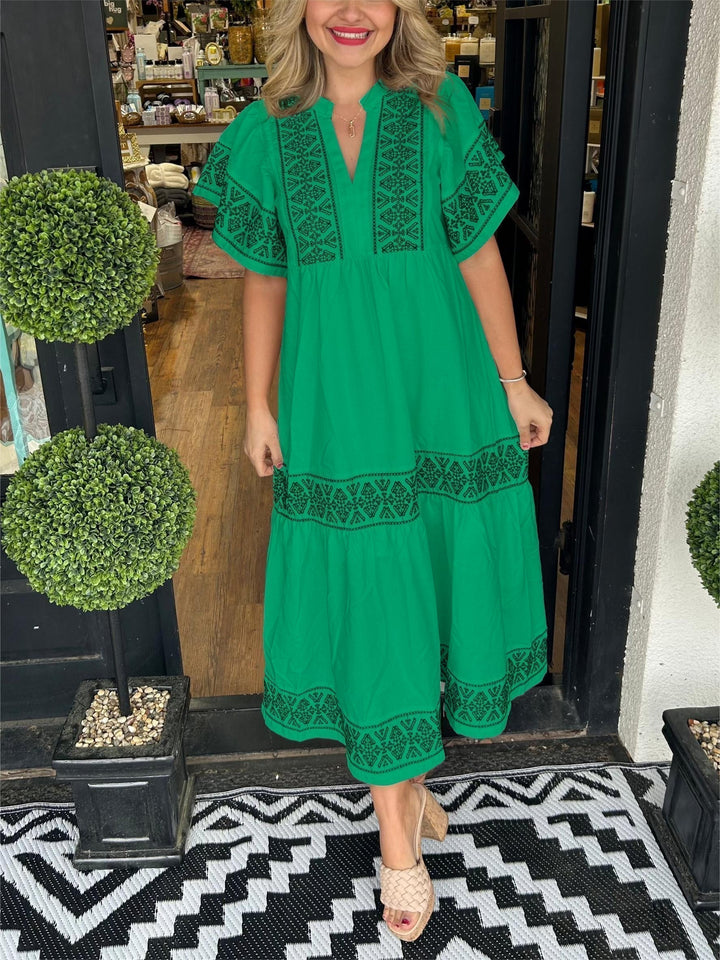 Women's casual summer style: embroidered boho midi dress with long sleeves, offering a breezy and chic look.