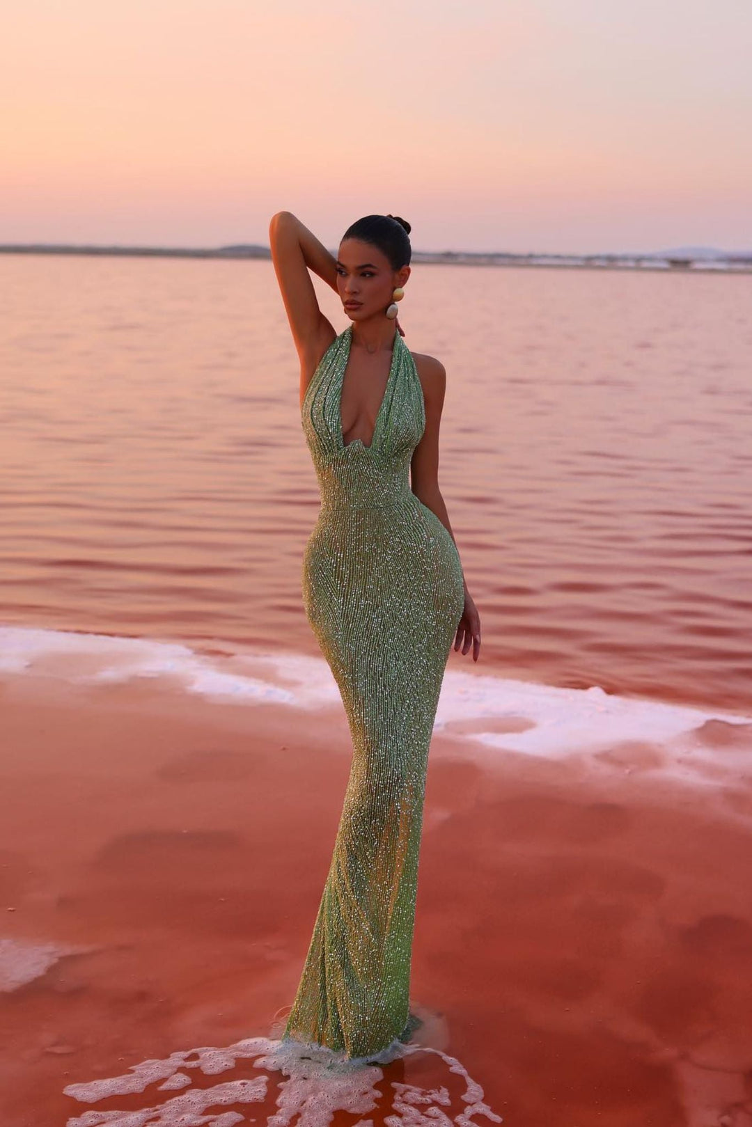 Beautiful full-length shot of an emerald green maxi dress, a sophisticated choice for women's evening fashion.
