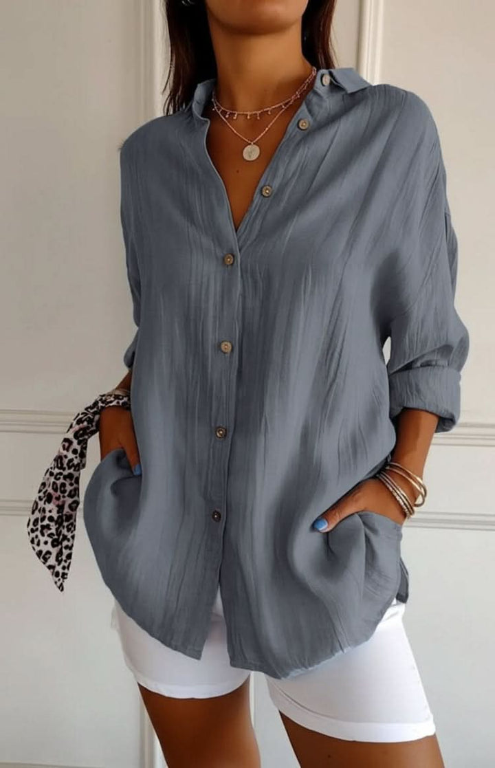 Elegant women's office blouse, a chic versatile long sleeve top for professional wear.