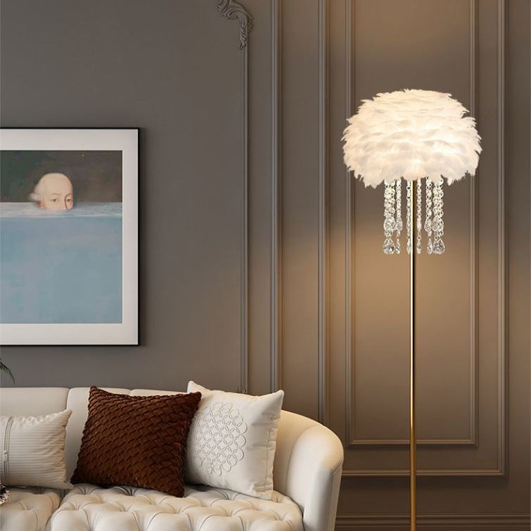 Scandinavian style Feather & Crystal floor lamp illuminating a cozy bedroom corner.