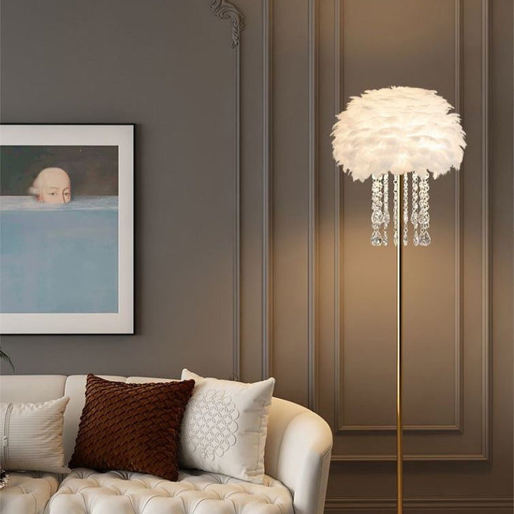Scandinavian style Feather & Crystal floor lamp illuminating a cozy bedroom corner.