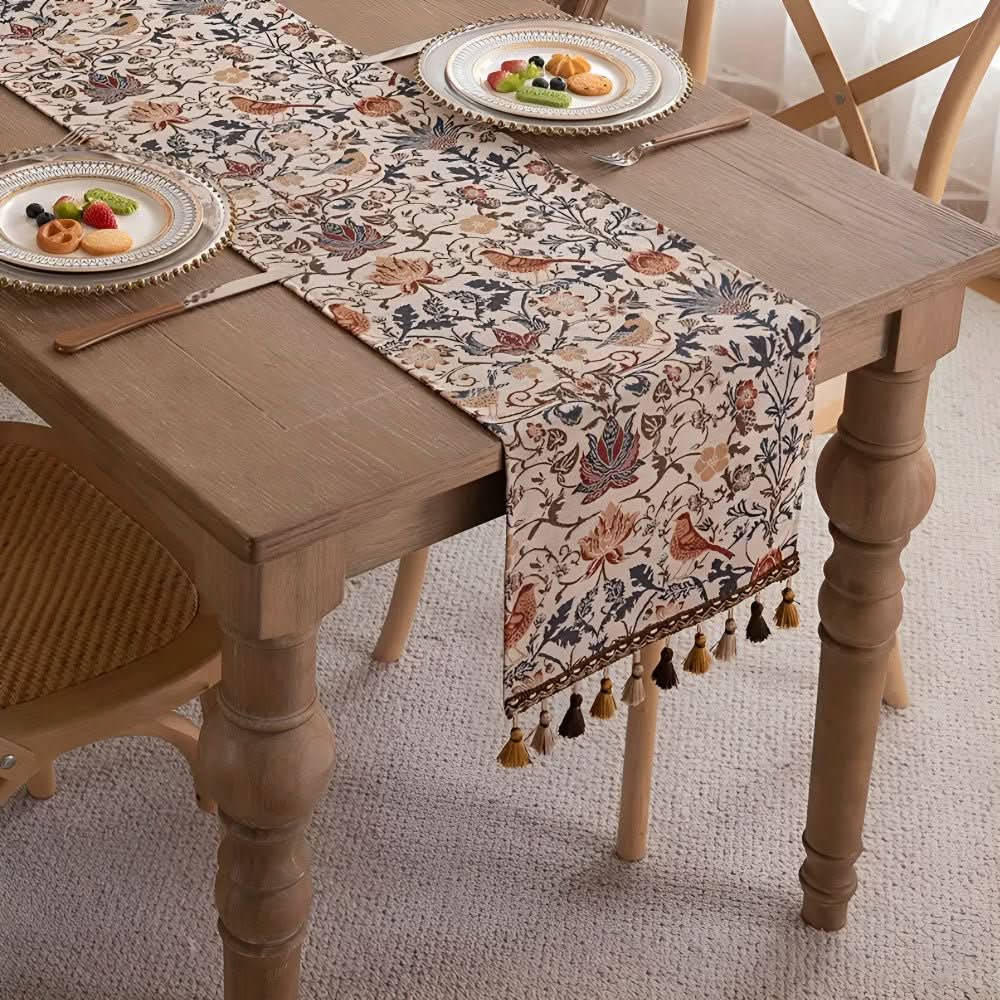 Rustic charm fringed jacquard table runner featuring elegant floral & bird design.