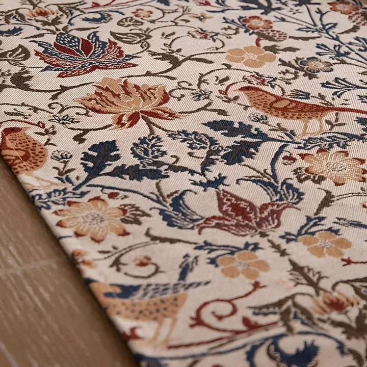 Jacquard table runner with a beautiful floral and bird design, ideal for vintage or rustic decor.