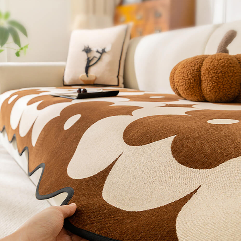 Washable chenille floral sofa cover draped over a couch, providing non-slip protection