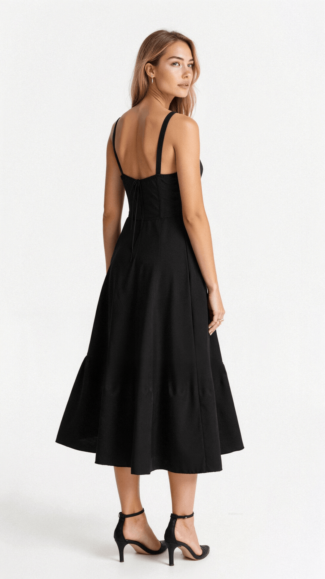 Close-up of the delicate floral pattern & corset detailing on a women's elegant midi dress with a leg slit.