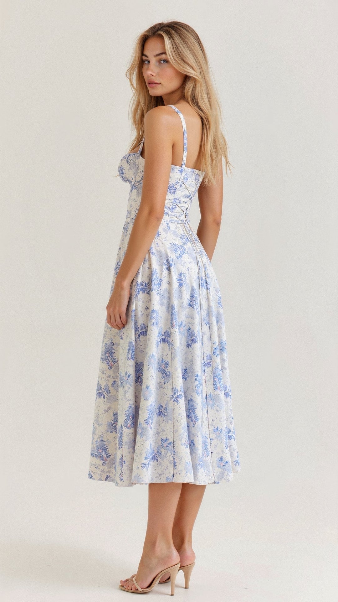 Flowing women's floral midi dress, featuring a structured corset top and a graceful slit for elegant movement.