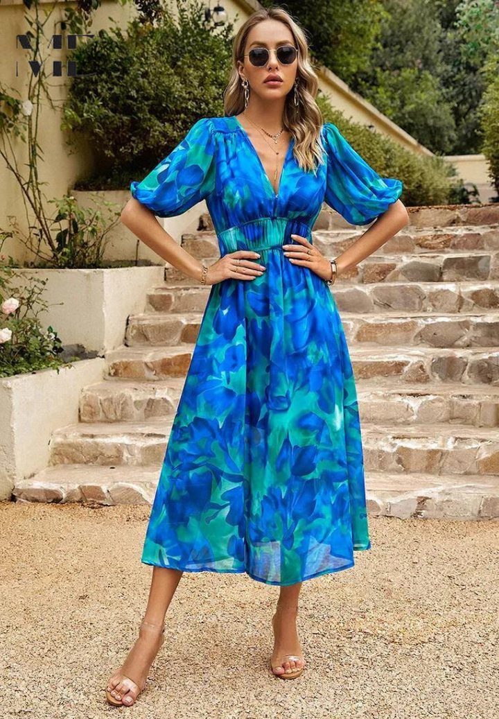 Feminine summer floral midi dress featuring puff sleeves, V-neck, and a flattering A-line silhouette.