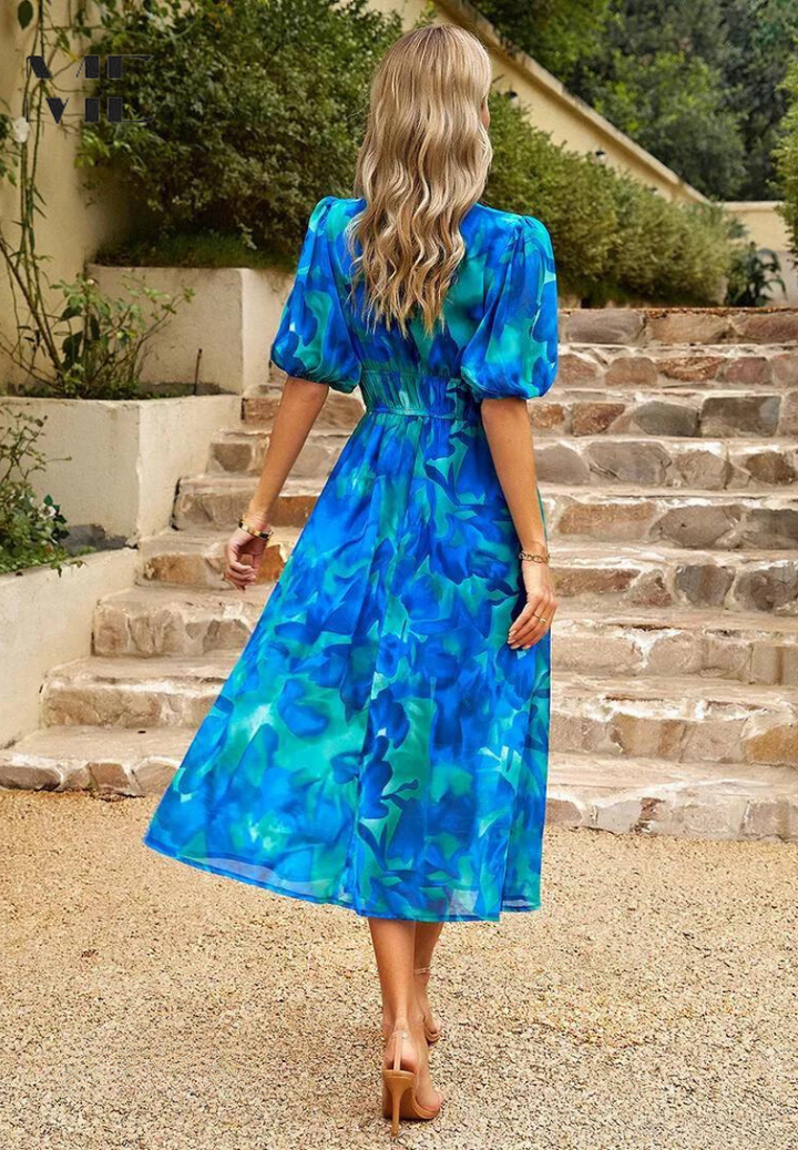 Elegant A-line floral midi dress with puff sleeves, V-neck, a perfect spring vacation outfit.