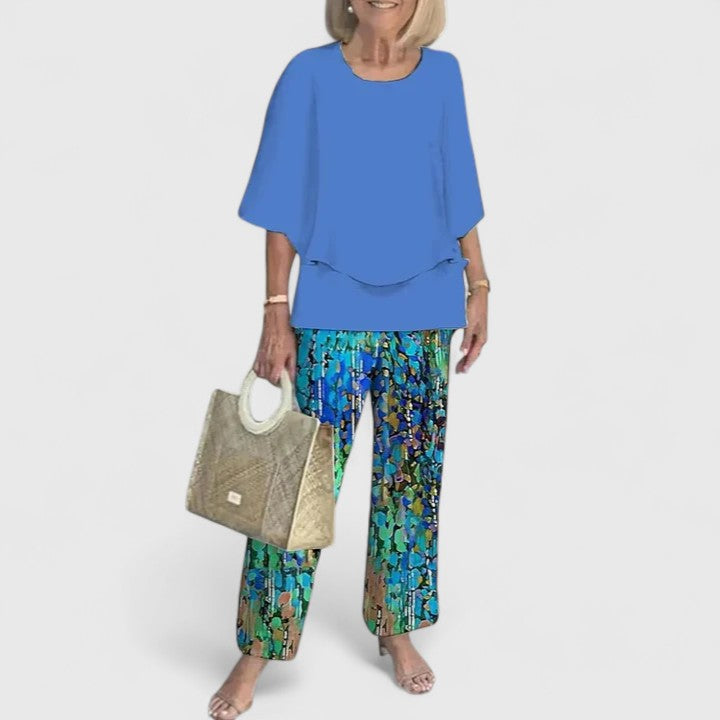 Casual chic women's floral matching set with wide-leg pants and layered top.