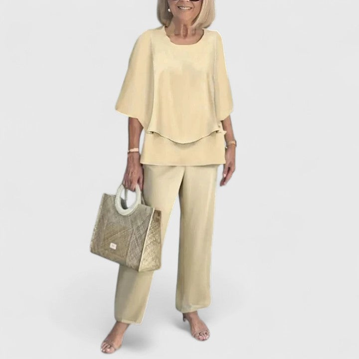 Chic women's floral print two-piece set with a flowing layered chiffon top.