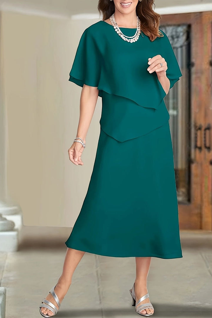 Elegant flowing green midi dress for women, perfect for summer, relaxed fit, versatile day to night style.