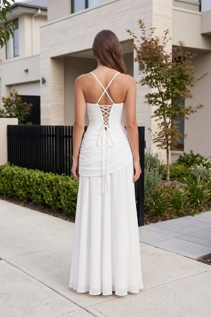 Model showcasing women's elegant flowing maxi dress, timeless sophistication perfect for any event.