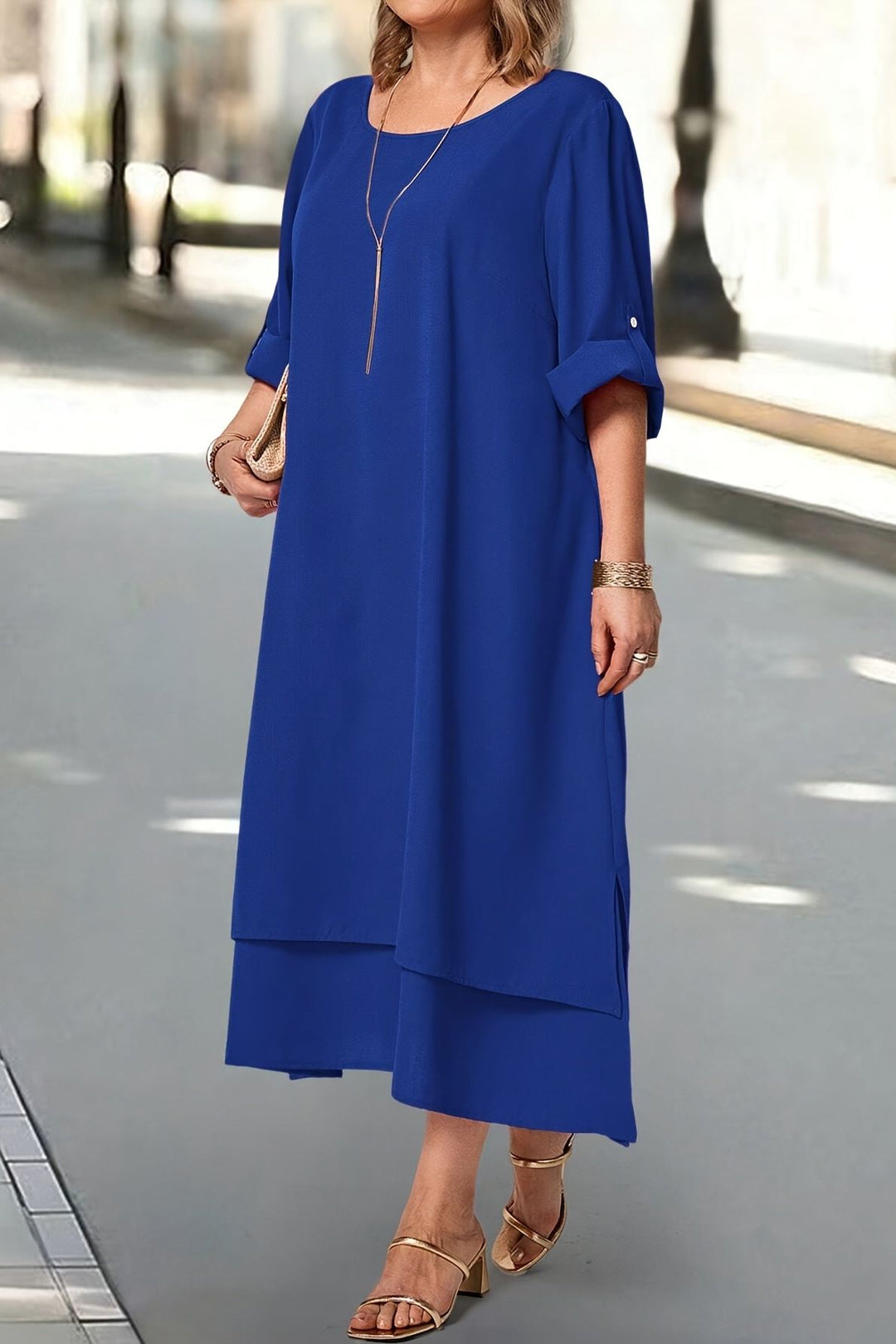 Elegant blue flowing women's maxi dress, a formal gown for evening wear and special occasions.