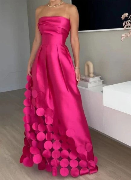 Elegant fuchsia strapless A-line maxi wedding guest dress for women. Perfect formal evening gown for special occasions.